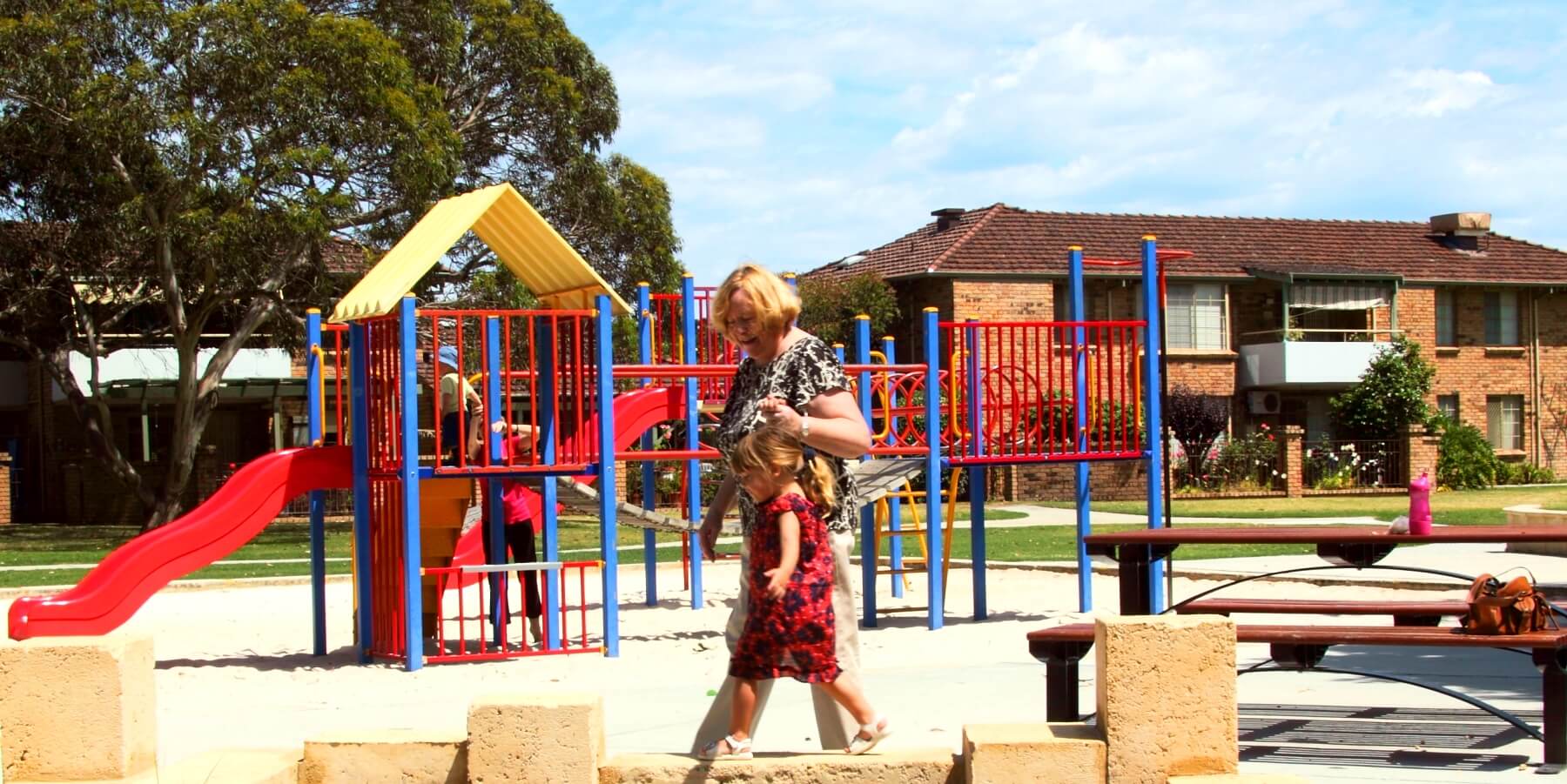 Villas adjacent to children's playground at St Ives Melville