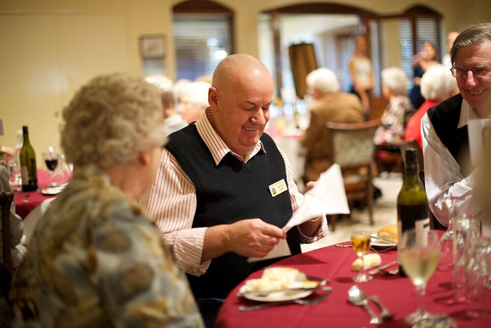 Residents socialising over dinner at St Ives Northshore retirement village